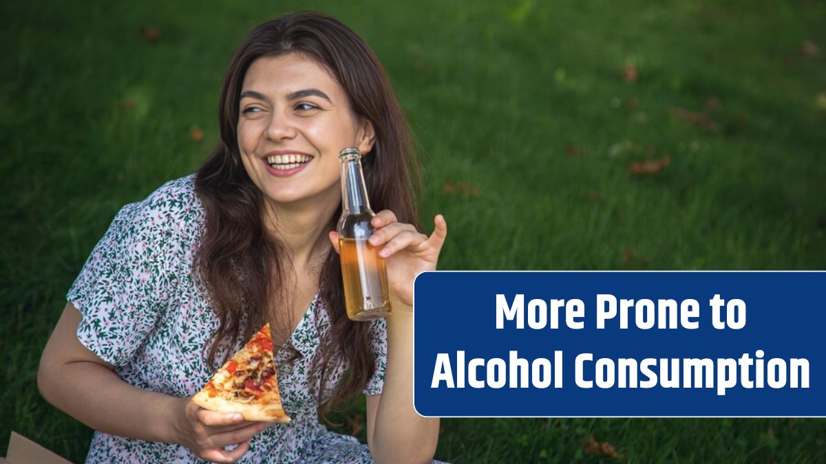 Happy young woman eating pizza at a picnic.