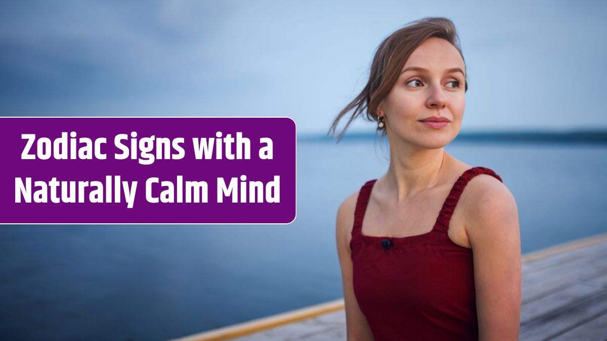 Beautiful young woman sitting on the wooden deck near the lake.